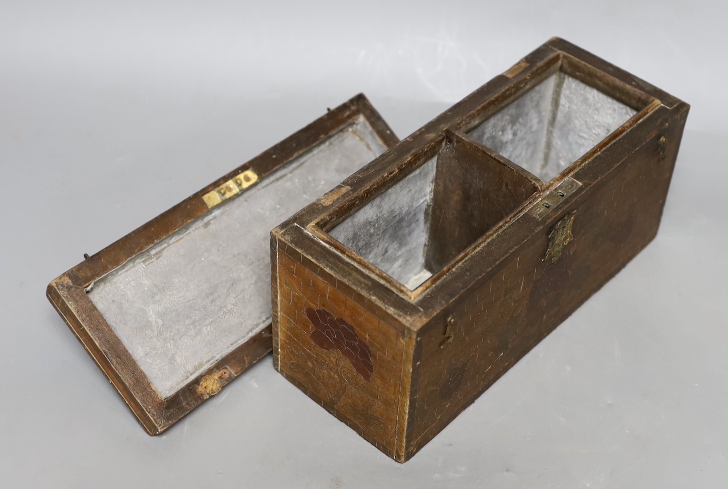 A late 19th century incised and painted tea caddy with floral brick decoration. 24cm wide